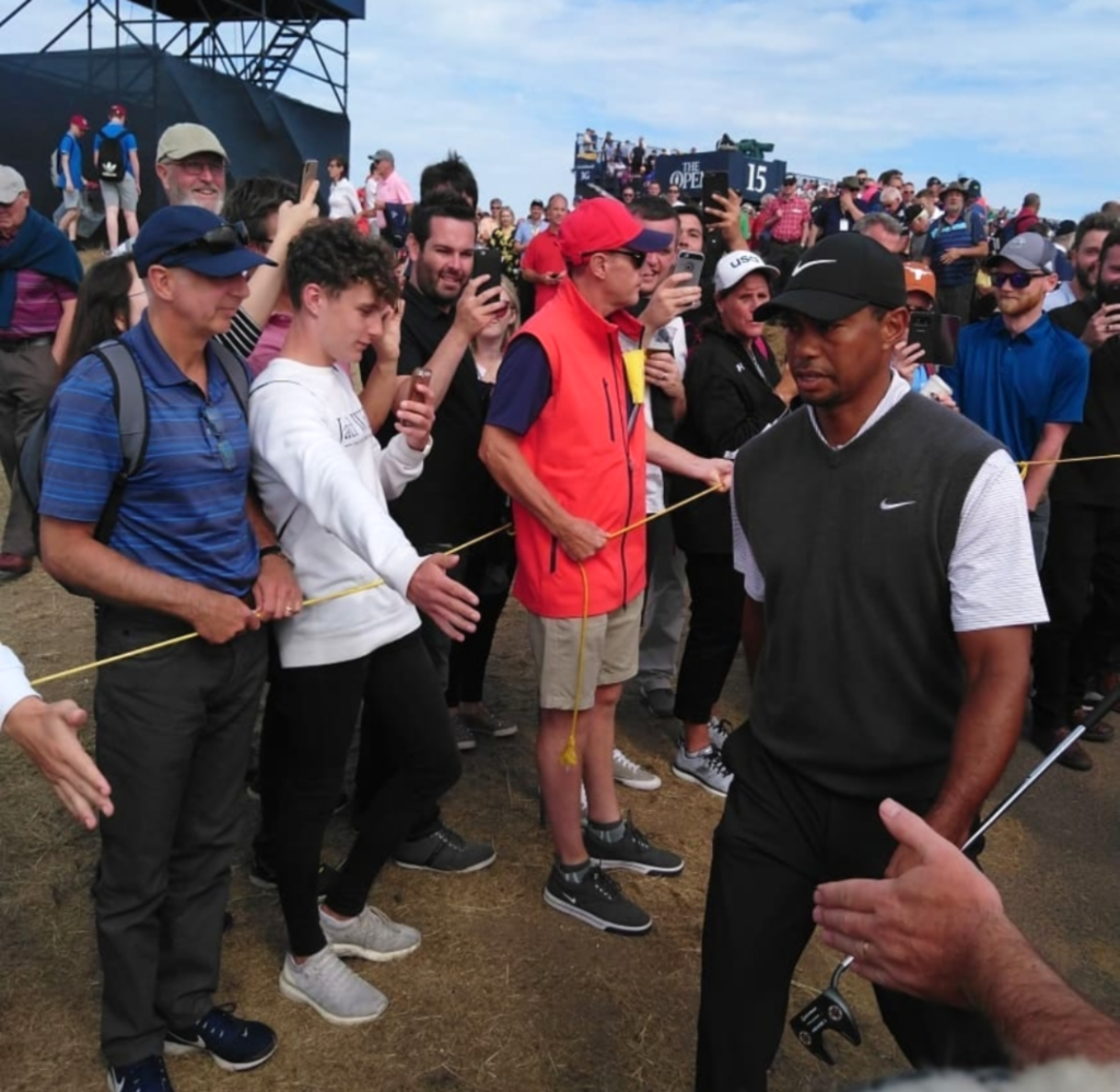 Tiger Woods walking through crowd at The Open
