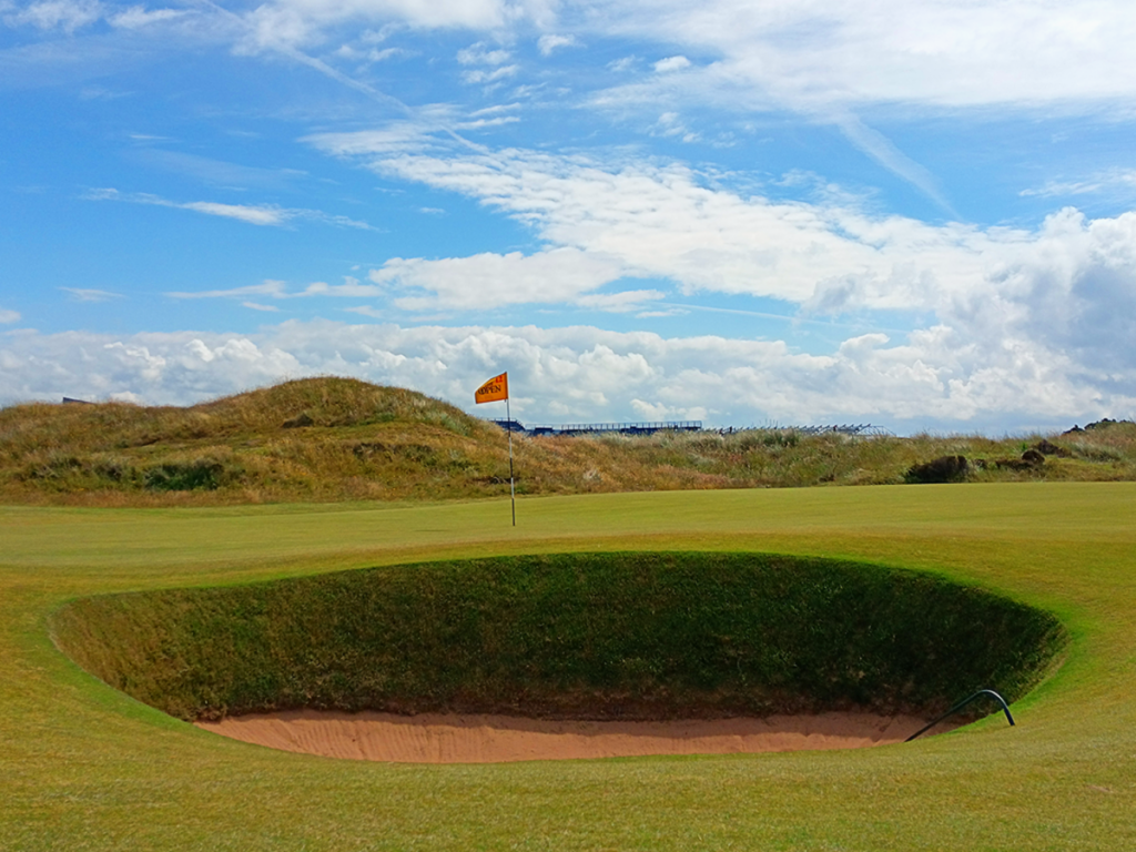 The Open Flag with bunker infront of green