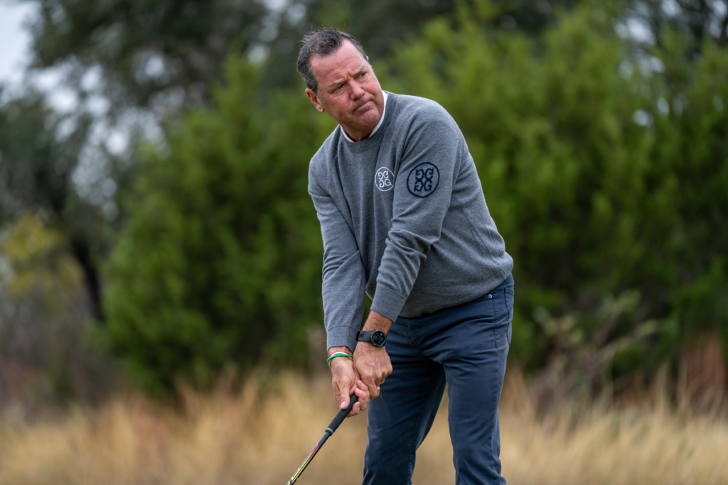 Rich Beem hitting shot on course