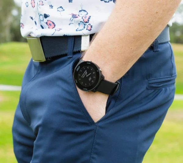 Golfer with G6 on wrist and hand in pocket
