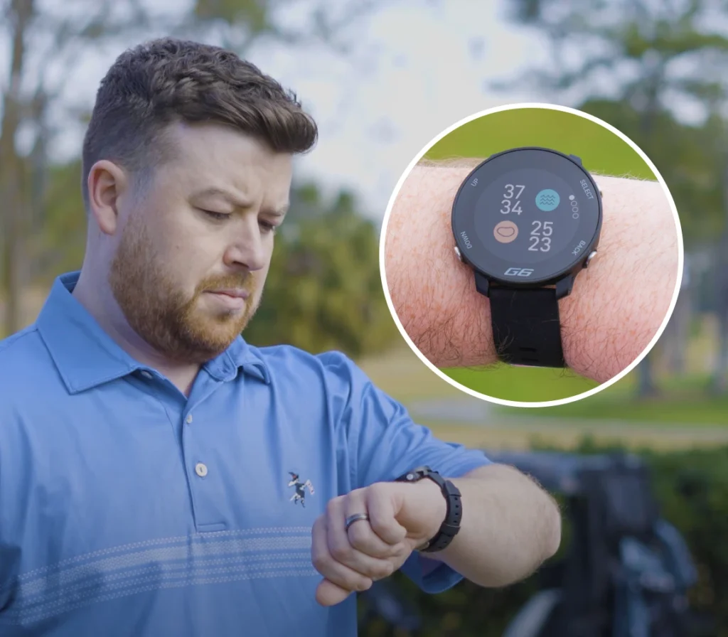 Golfer looking at watch with the Shot Scope hazards screen on the G6