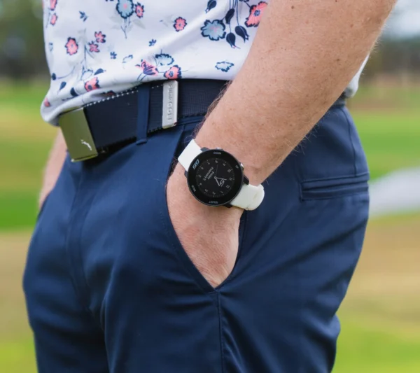 Golfer with hand in pocket with G6 on wrist