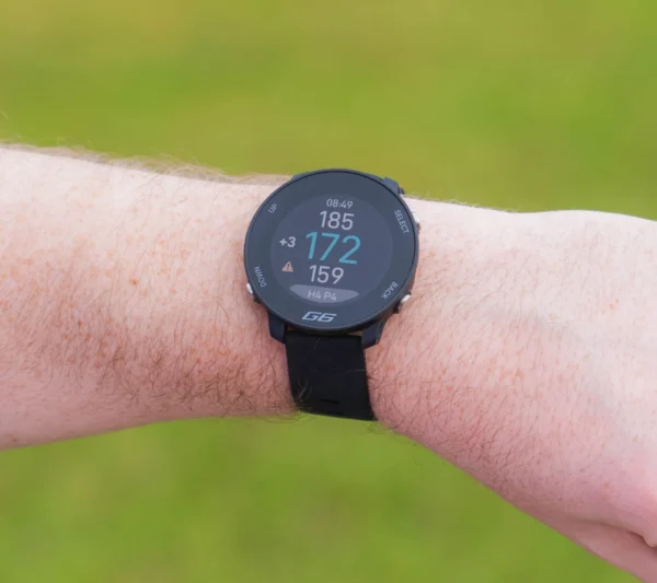 Shot Scope G6 on wrist with F/M/B distances on screen